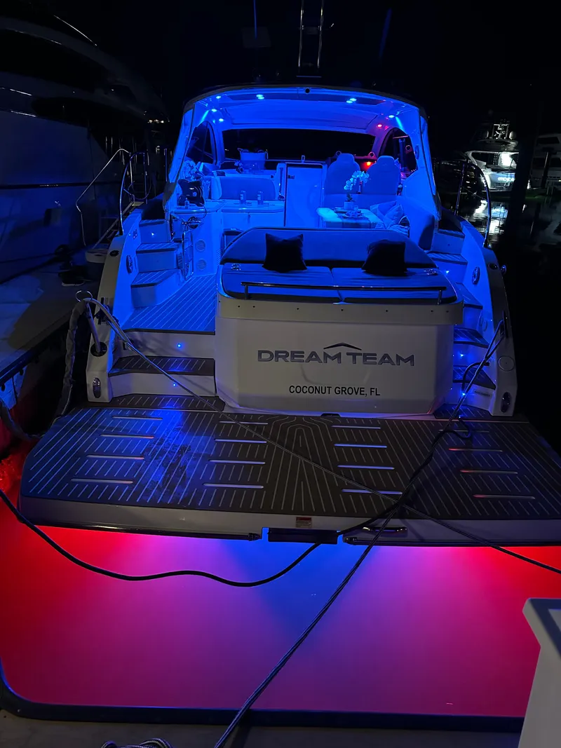 Slide: The Image of Azimut Atlantis 45 yacht, 2021 model, illuminated with blue and red lights at night. - 12