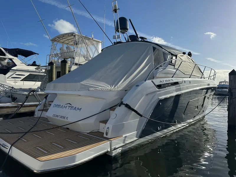 Slide: The Image of Azimut Atlantis 45 yacht, 2021 model, docked at marina under clear blue sky. - 13