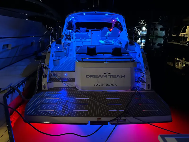 Slide: The Image of Azimut Atlantis 45 yacht, 2021 model, illuminated with blue and red lights at night. - 17