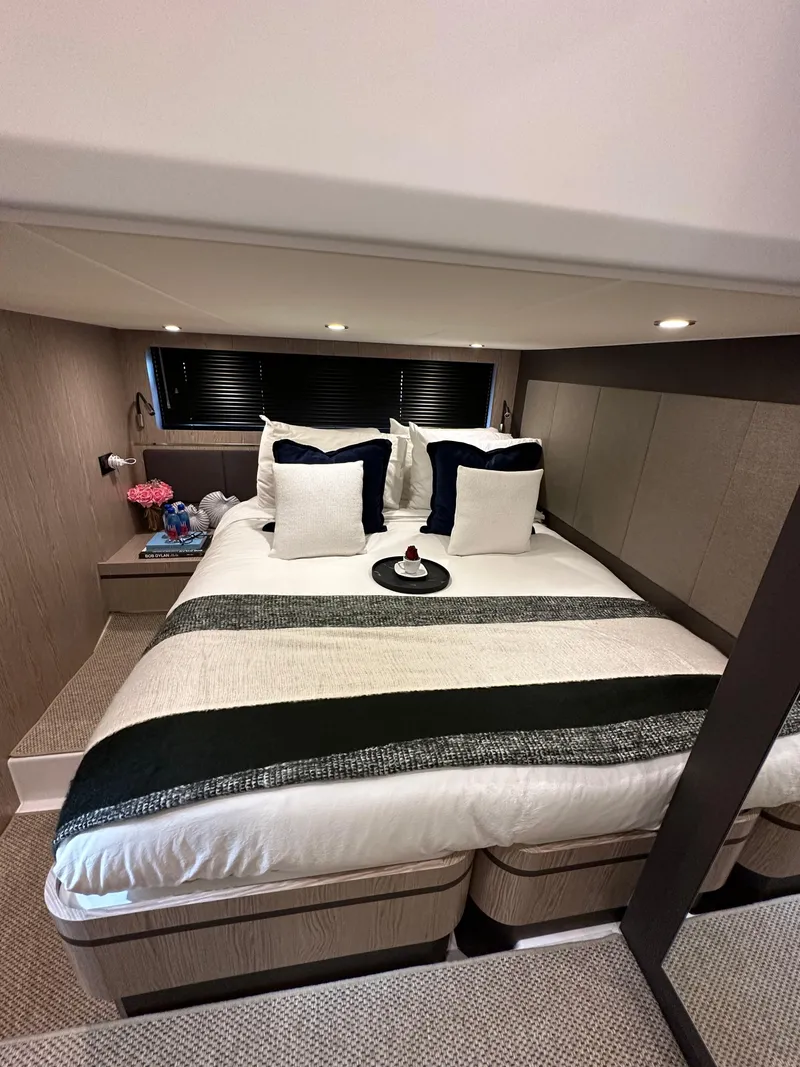 Slide: The Image of Luxurious bedroom interior of 2021 Azimut Atlantis 45 yacht with elegant bedding and modern design. - 2
