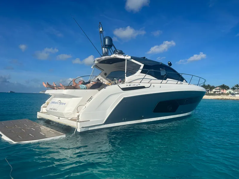 Slide: The Image of Azimut Atlantis 45 yacht, 2021 model, anchored in clear blue water under a sunny sky. - 22