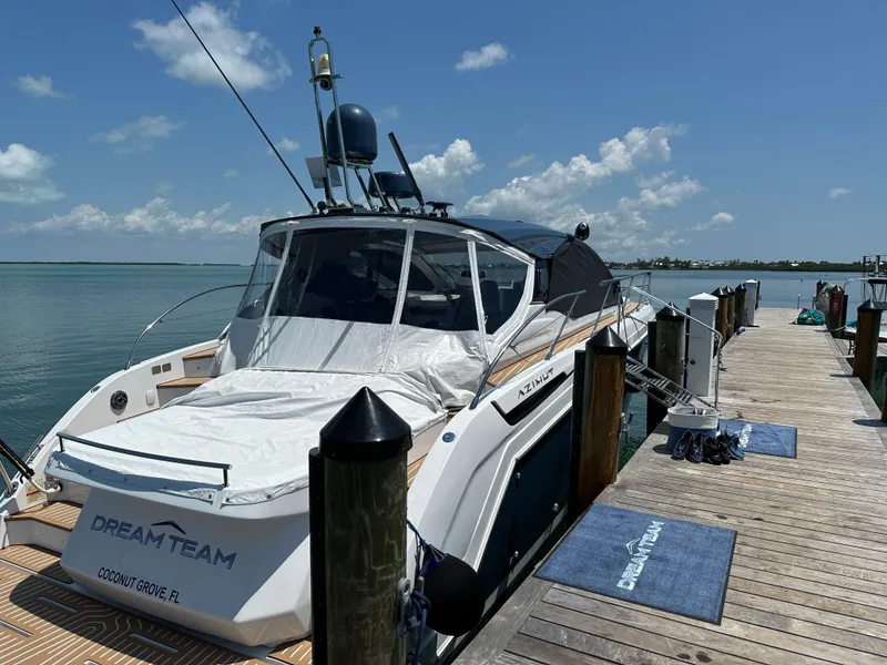 Slide: The Image of 2021 Azimut Atlantis 45 yacht docked at a sunny marina. - 27