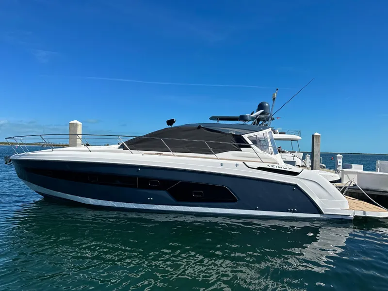 Slide: The Image of 2021 Azimut Atlantis 45 yacht docked in clear blue waters. - 28