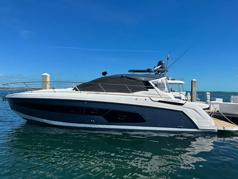 Slide: The Image of 2021 Azimut Atlantis 45 yacht docked in sunny marina, sleek design, blue sky backdrop. - 29