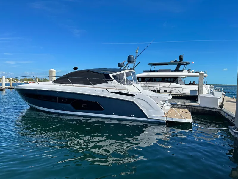 Slide: The Image of Azimut Atlantis 45 yacht, 2021 model, docked at marina under clear blue sky. - 33