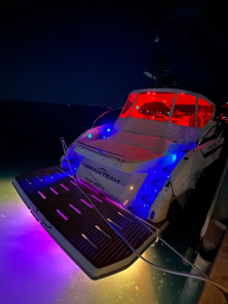 Slide: The Image of Azimut Atlantis 45 yacht, 2021 model, illuminated with colorful lights at night. - 35