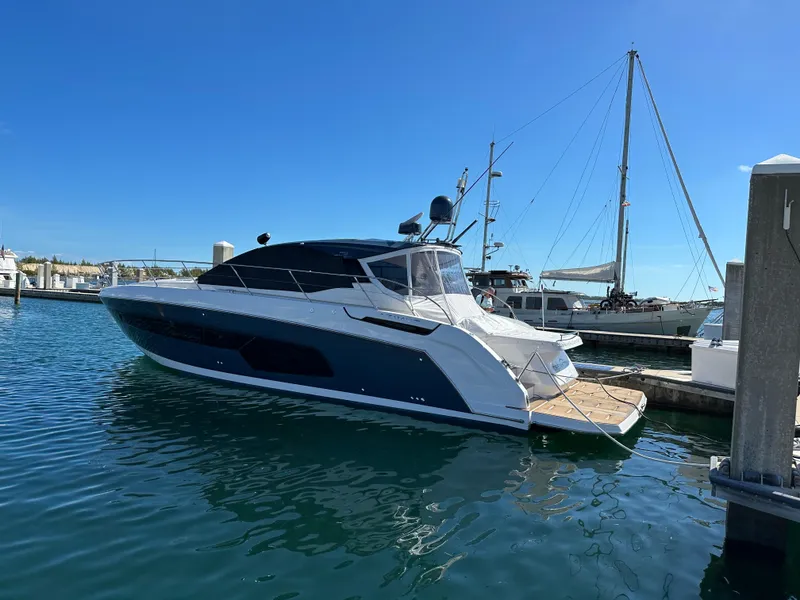 Slide: The Image of 2021 Azimut Atlantis 45 yacht docked in a marina under clear blue skies. - 37