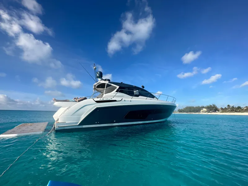 Slide: The Image of Azimut Atlantis 45 yacht, 2021 model, anchored in clear blue waters under a sunny sky. - 39