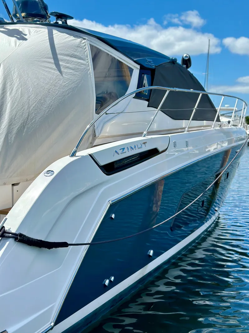 Slide: The Image of 2021 Azimut Atlantis 45 yacht docked, featuring sleek design and modern aesthetics. - 4