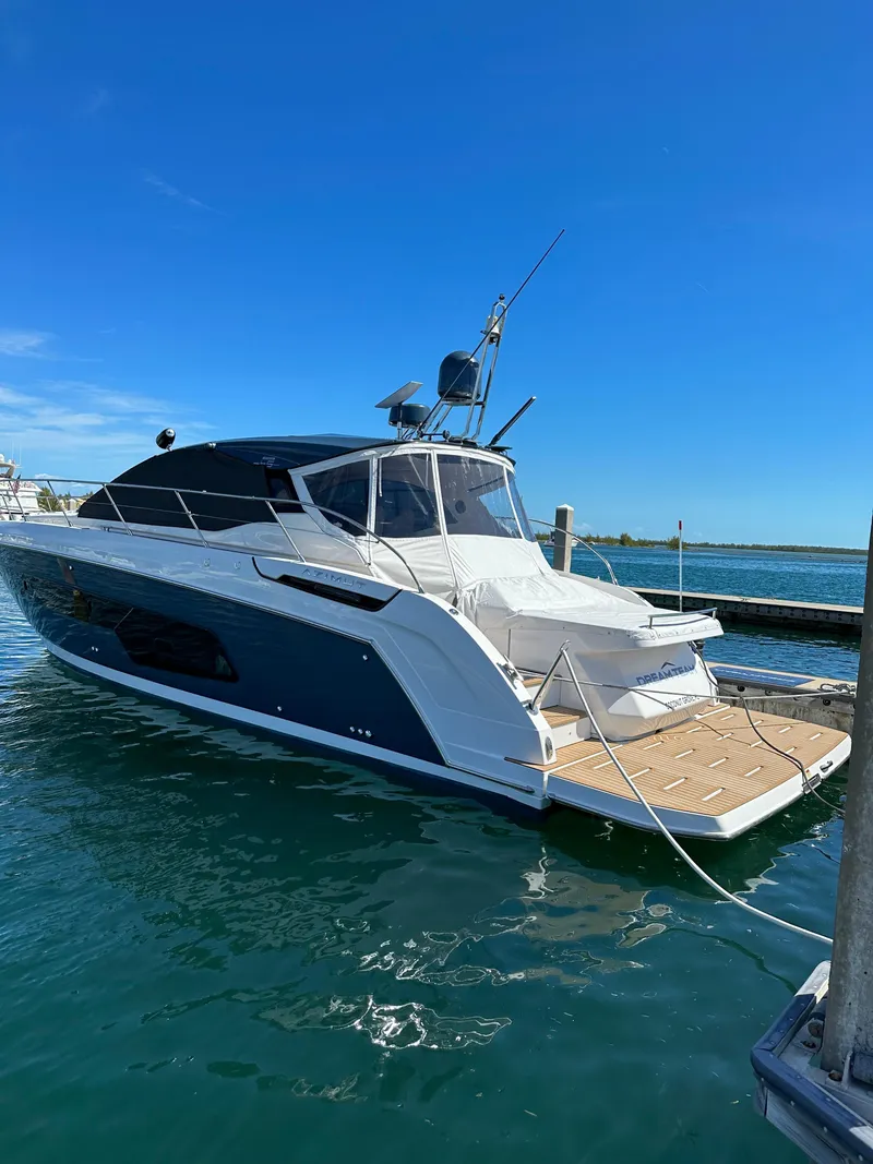 Slide: The Image of 2021 Azimut Atlantis 45 yacht docked in a marina under clear blue skies. - 43