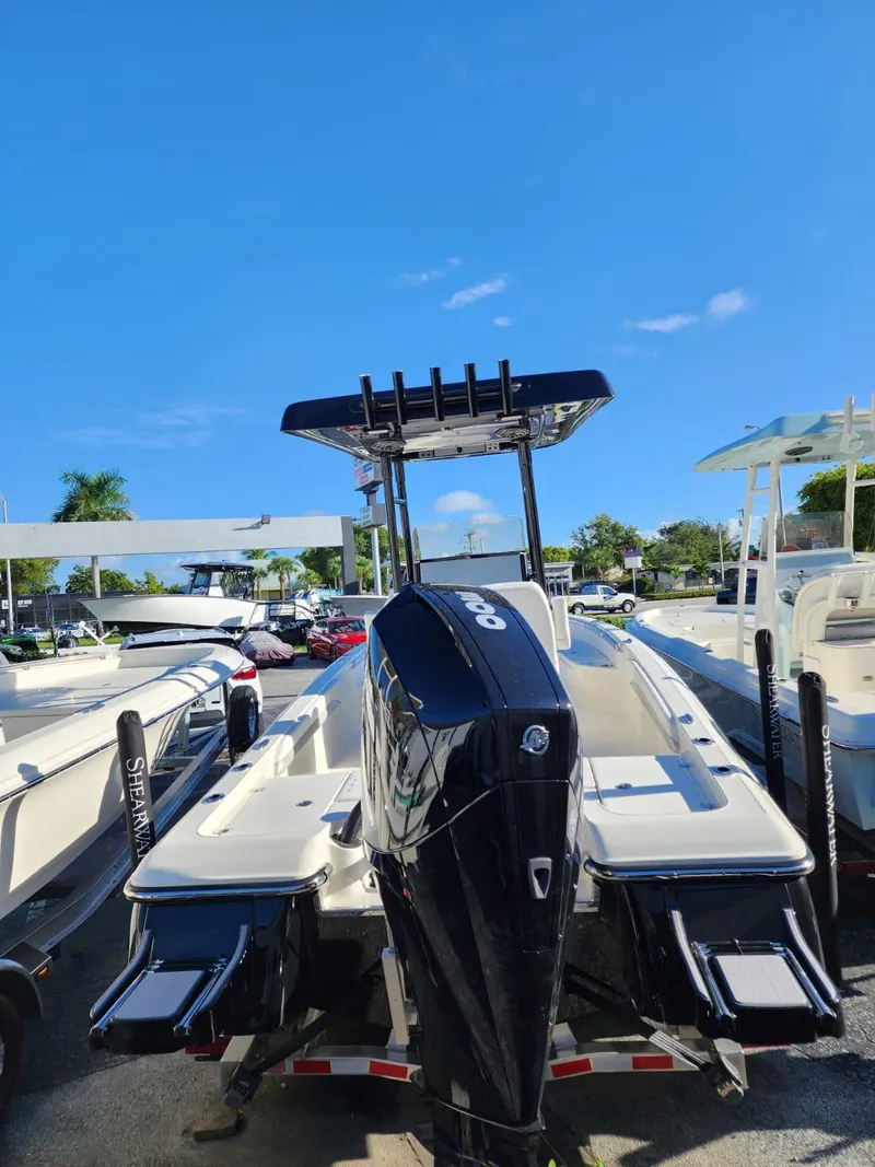 Slide: The Image of 2023 ShearWater 250 XTE boat with sleek design and powerful engine, displayed outdoors. - 4