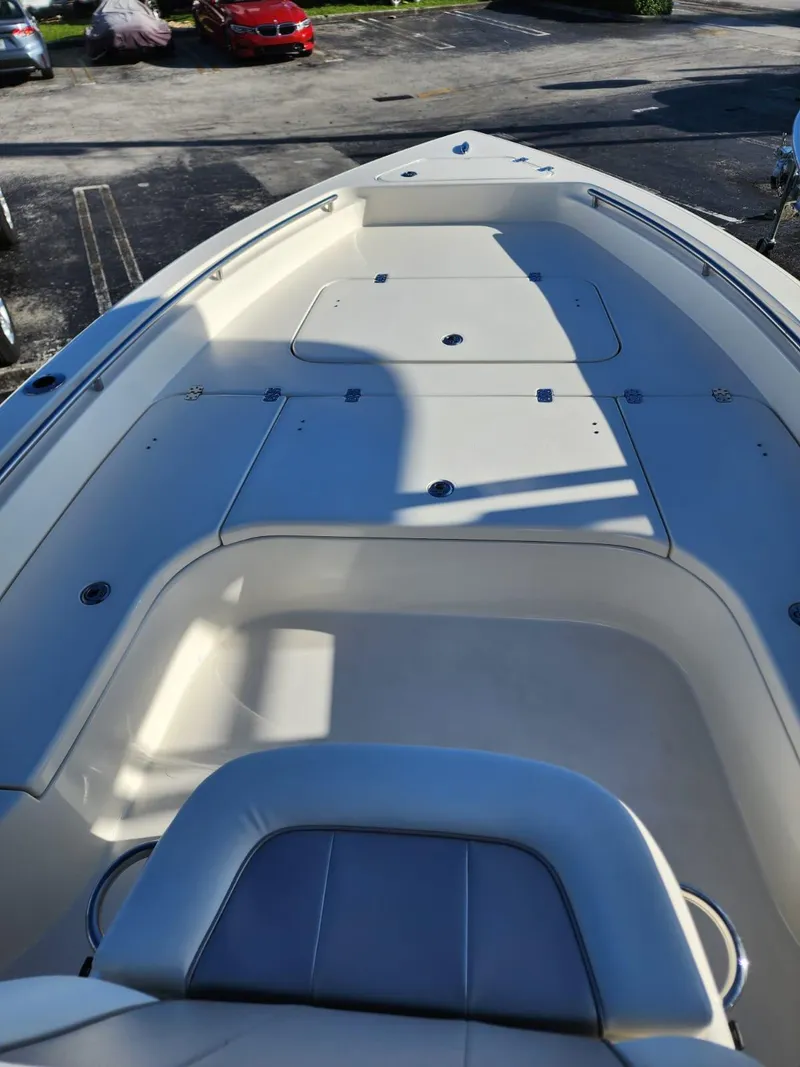 Slide: The Image of 2023 ShearWater 250 XTE boat deck, featuring spacious seating and storage areas. - 6