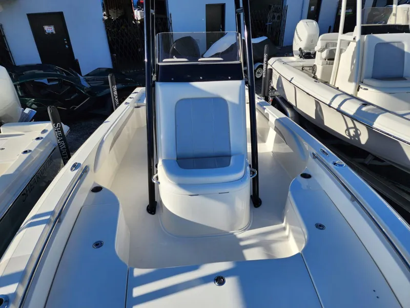 Slide: The Image of 2023 ShearWater 250 XTE boat interior with seating and console. - 8