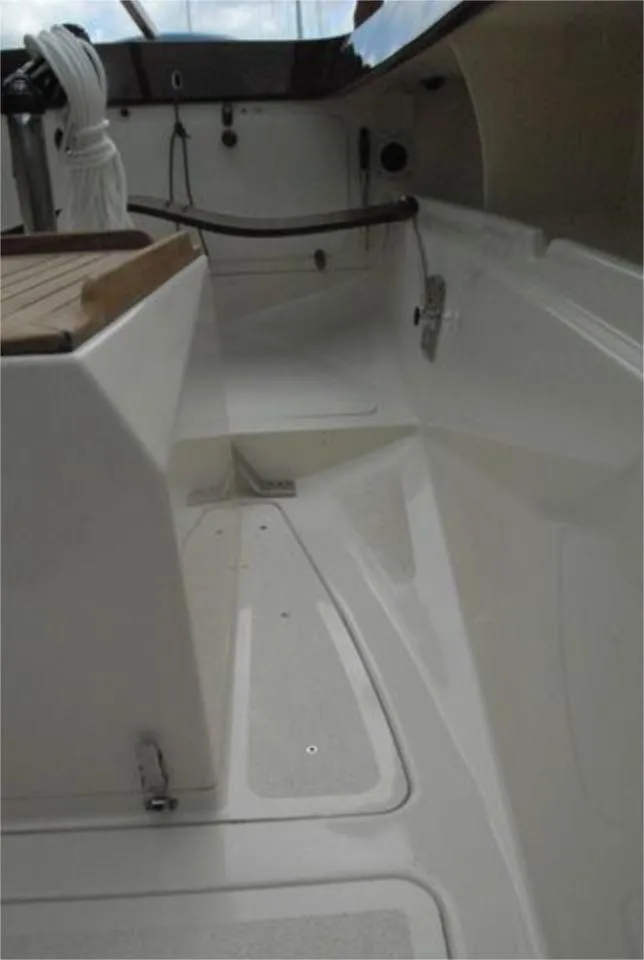 Slide: The Image of 2025 Rustler 24 sailboat cockpit with sleek white interior design. - 20