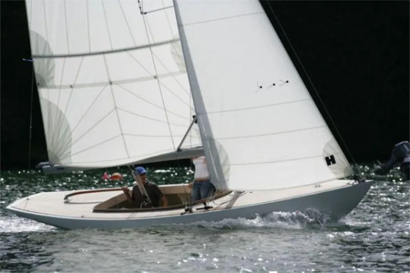 Slide: The Image of Sailing on water, Rustler 24 yacht, 2025 model, with white sails and crew. - 7