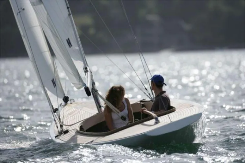 Slide: The Image of Two people sailing a 2025 Rustler 24 yacht on a sunny day. - 8