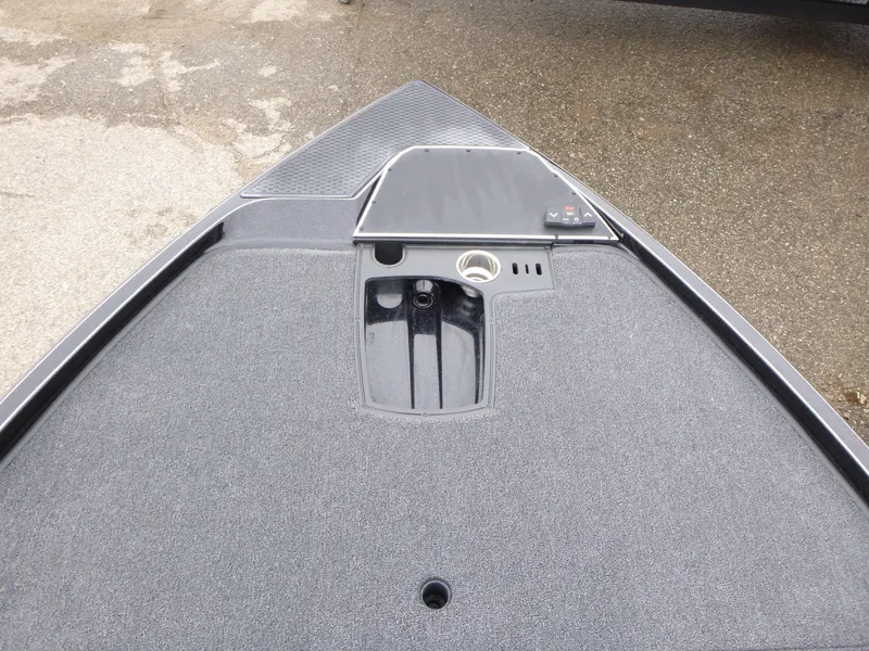 Slide: The Image of 2025 Ranger Z521 boat interior with open storage compartments and control panel. - 14