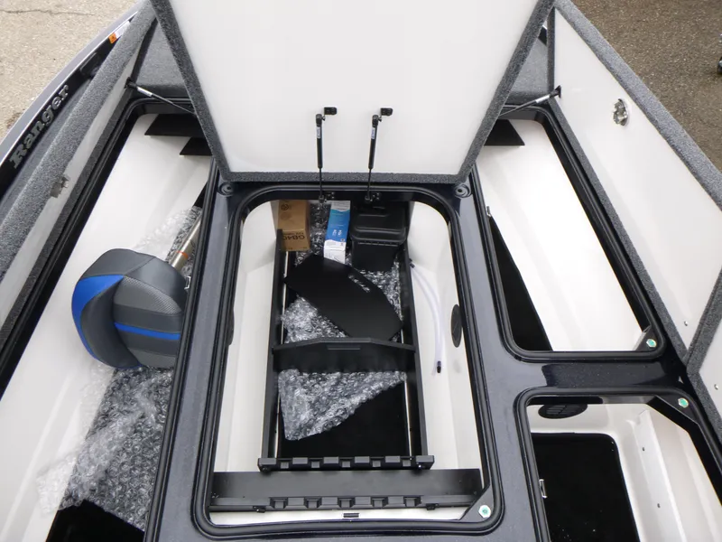 Slide: The Image of 2025 Ranger Z521 boat interior with blue and gray seats, showcasing modern design. - 15