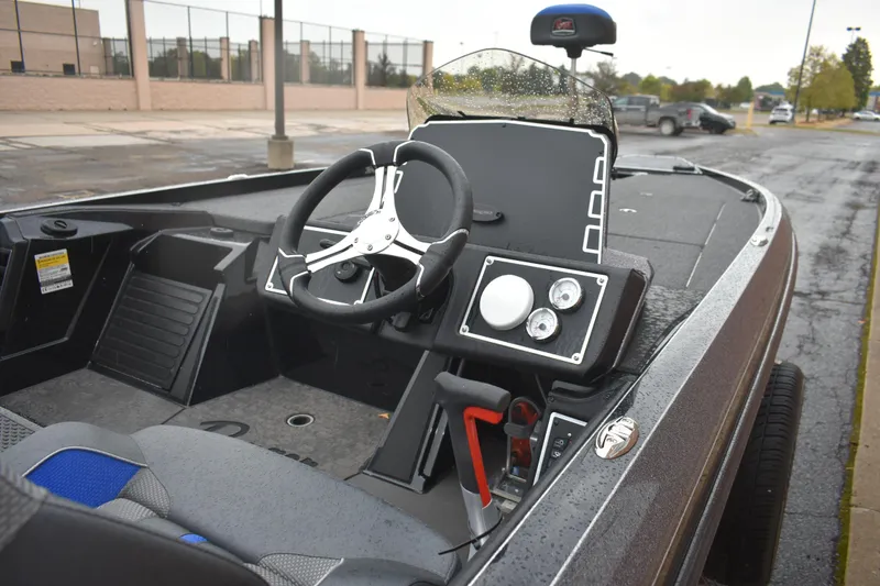 Slide: The Image of 2025 Ranger Z521 boat interior with steering wheel and dashboard controls. - 4