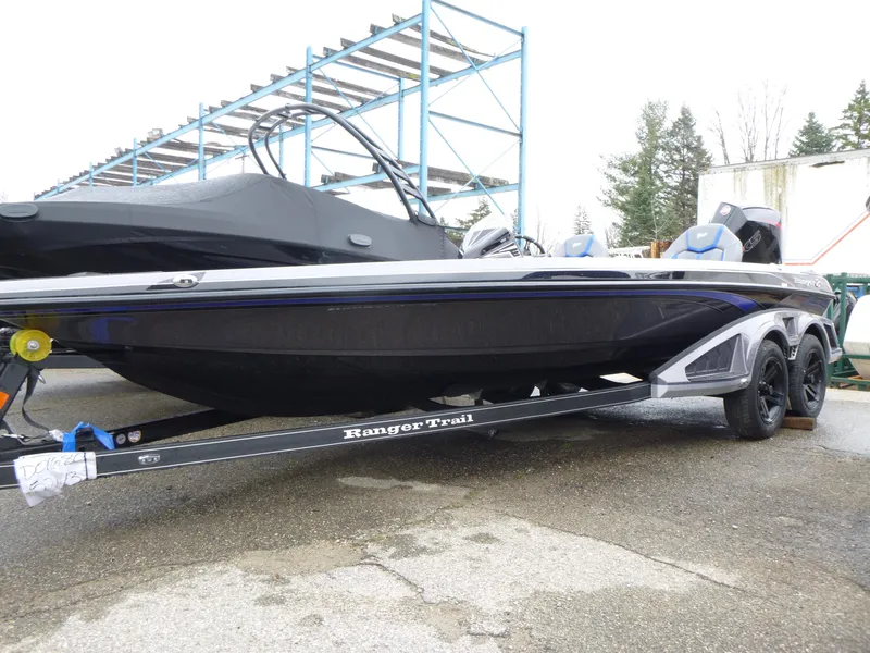 Slide: The Image of 2025 Ranger Z521 boat with blue seats and metallic finish. - 5