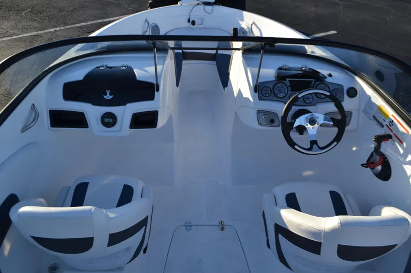 Slide: The Image of 2024 Tahoe 200 S boat interior with dual seats and modern dashboard. - 3