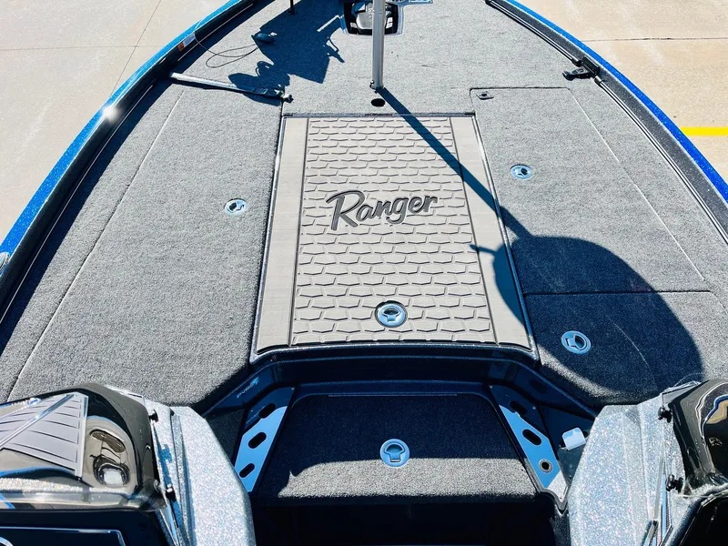 Slide: The Image of 2025 Ranger Z520R Cup-Equipped boat deck with logo and storage compartments. - 13