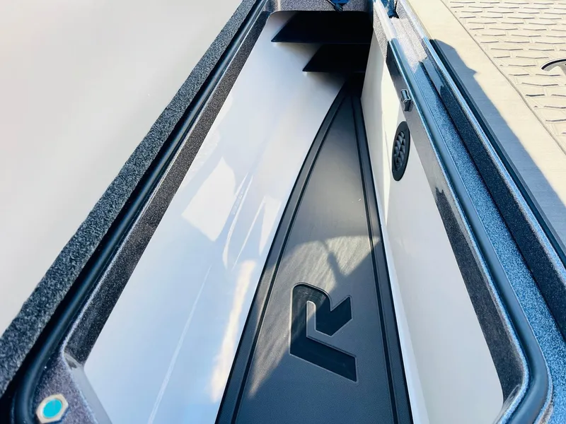 Slide: The Image of 2025 Ranger Z520R Cup-Equipped boat storage compartment with logo detail. - 15