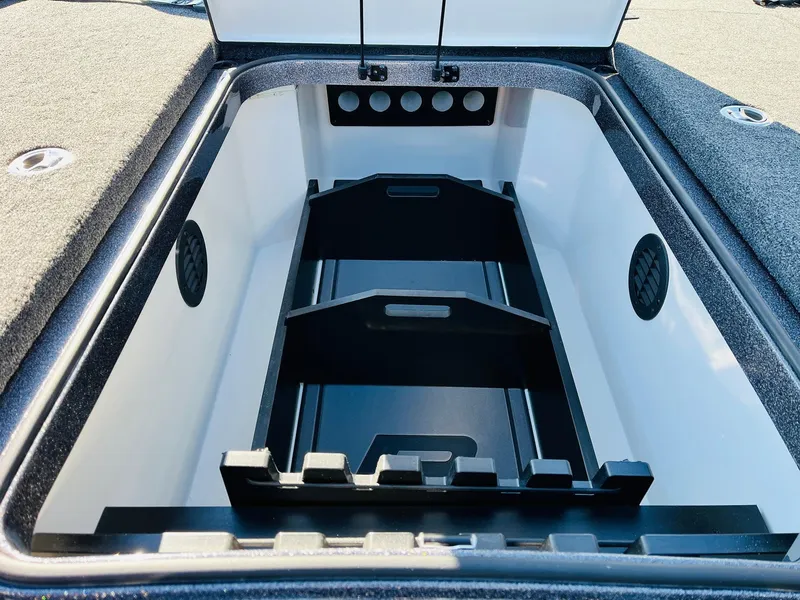 Slide: The Image of 2025 Ranger Z520R Cup-Equipped storage compartment, open and empty, with organized interior layout. - 17