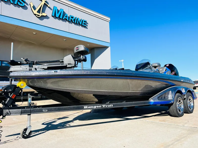 Slide: The Image of 2025 Ranger Z520R Cup-Equipped boat on trailer outside marine dealership. - 2