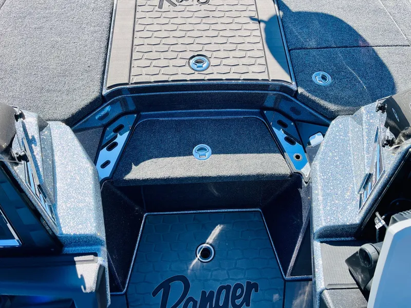 Slide: The Image of 2025 Ranger Z520R Cup-Equipped boat interior with textured flooring and storage compartments. - 22