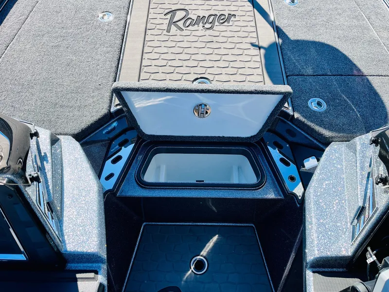 Slide: The Image of 2025 Ranger Z520R Cup-Equipped boat interior with storage compartments open. - 23