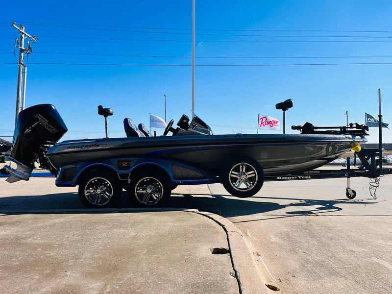 Slide: The Image of 2025 Ranger Z520R Cup-Equipped boat on trailer, parked outdoors under clear blue sky. - 3