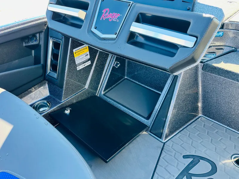 Slide: The Image of 2025 Ranger Z520R Cup-Equipped boat dashboard with storage compartments and sleek design. - 31