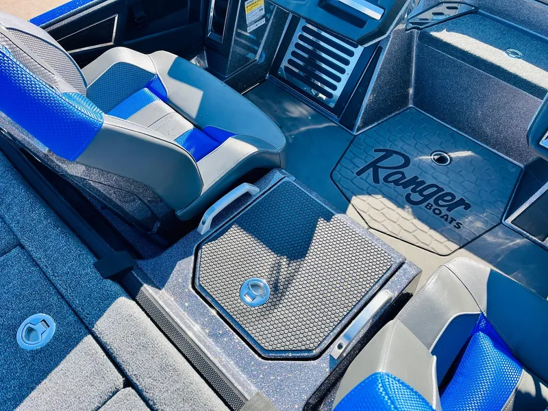 Slide: The Image of 2025 Ranger Z520R Cup-Equipped boat interior with blue and gray seating. - 35