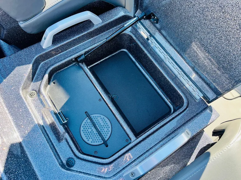 Slide: The Image of 2025 Ranger Z520R Cup-Equipped storage compartment with open lid, showcasing interior design. - 37