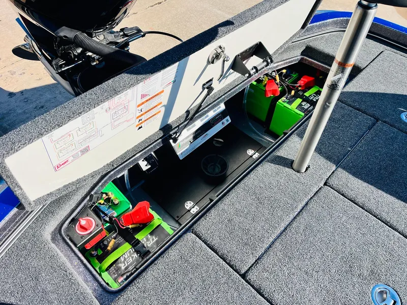 Slide: The Image of 2025 Ranger Z520R Cup-Equipped boat battery compartment with organized wiring and components. - 48