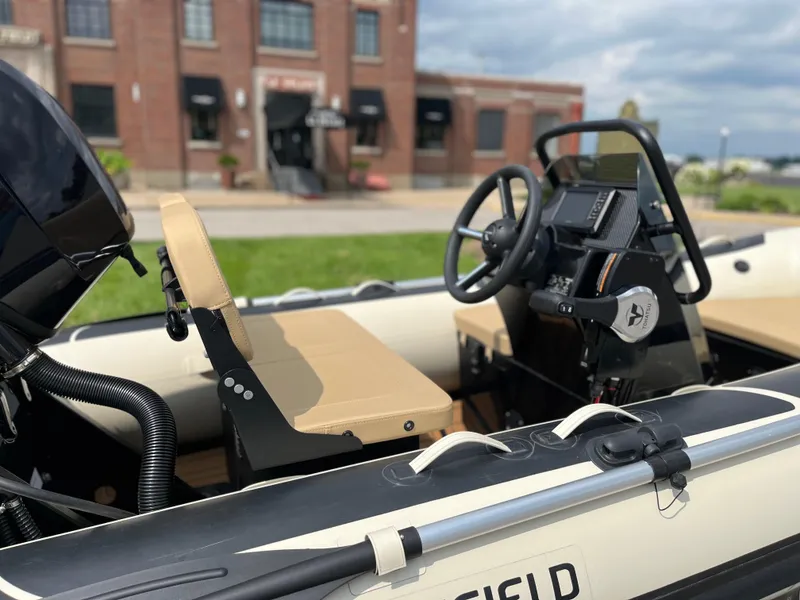 Slide: The Image of 2025 Highfield Classic 360 GT boat interior with steering wheel and seats. - 3