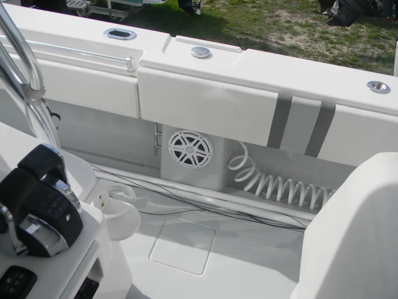 Slide: The Image of 2019 Contender 39 ST boat interior with control panel and coiled hose. - 13