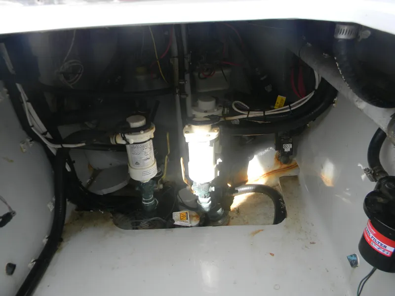 Slide: The Image of 2019 Contender 39 ST boat interior showing mechanical components and wiring. - 18