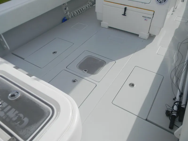 Slide: The Image of 2019 Contender 39 ST boat deck with storage compartments and seating. - 2