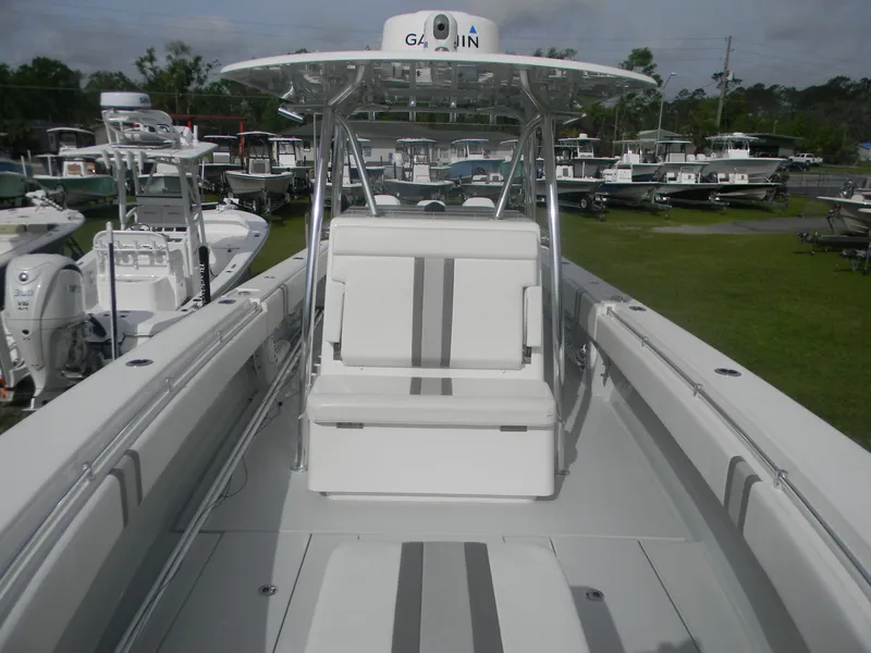 Slide: The Image of 2019 Contender 39 ST boat with center console and seating, displayed outdoors. - 7