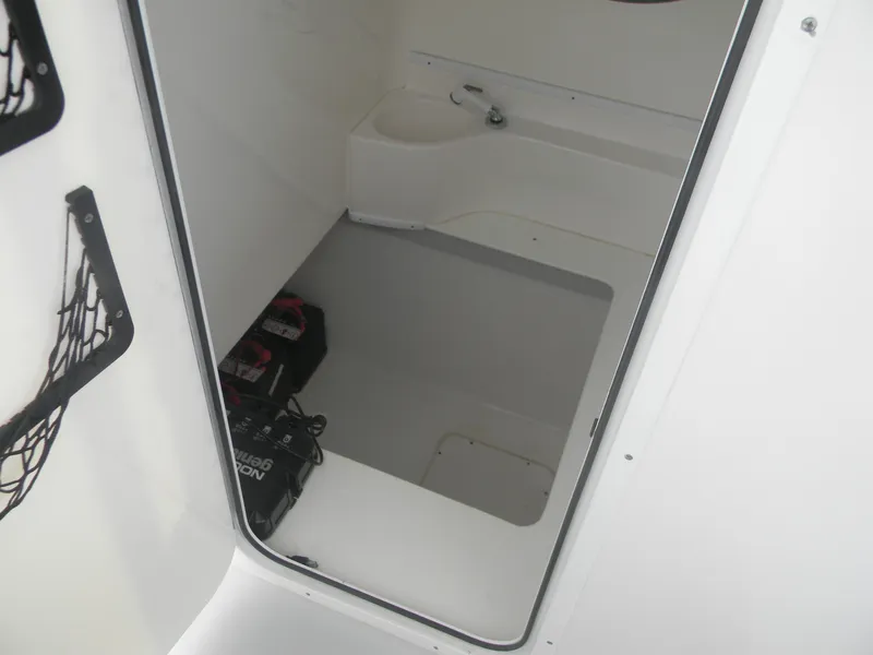 Slide: The Image of 2019 Contender 39 ST interior compartment with storage and battery setup. - 9