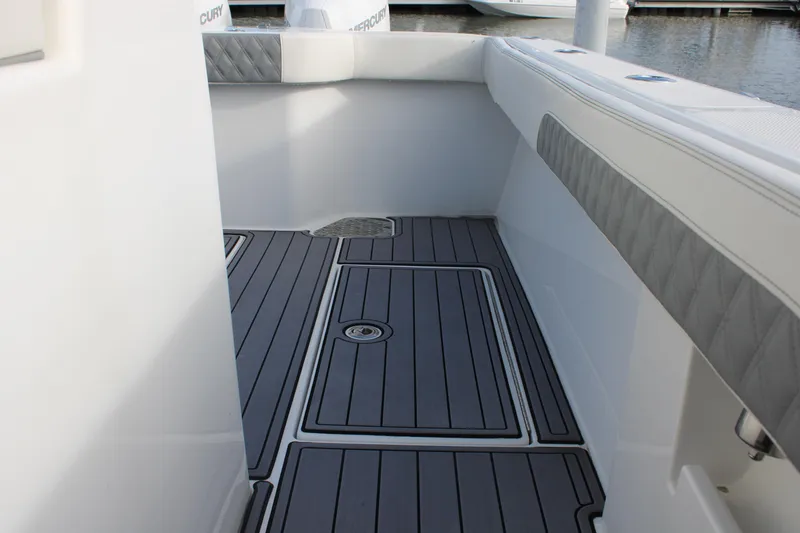 Slide: The Image of 2023 Front Runner 33 Center Console boat interior with sleek gray flooring. - 11