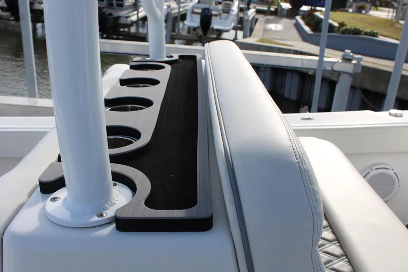 Slide: The Image of 2023 Front Runner 33 Center Console boat interior with cup holders and seating. - 13