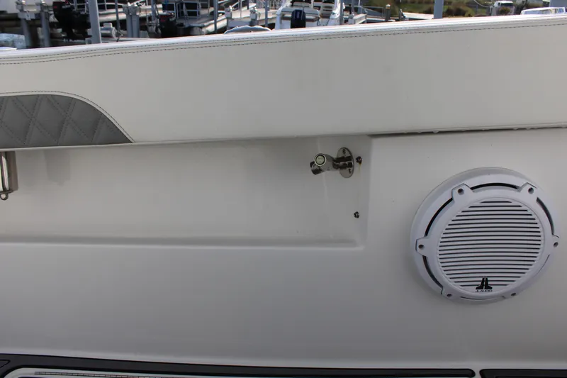Slide: The Image of 2023 Front Runner 33 Center Console boat interior with speaker and hardware detail. - 17