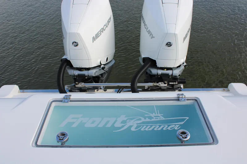 Slide: The Image of 2023 Front Runner 33 Center Console with twin Mercury engines on water. - 18