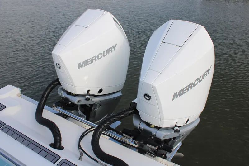 Slide: The Image of Twin Mercury outboard engines on 2023 Front Runner 33 Center Console boat. - 19