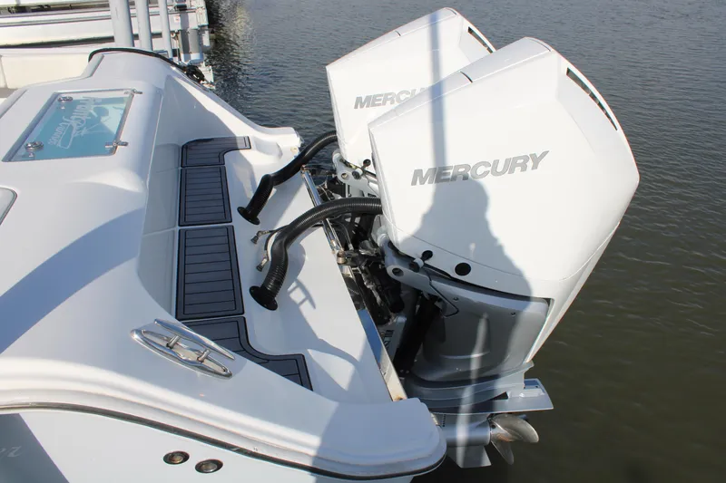 Slide: The Image of 2023 Front Runner 33 Center Console with dual Mercury outboard engines. - 2
