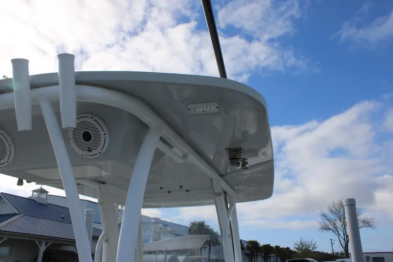 Slide: The Image of 2023 Front Runner 33 Center Console boat with T-top against blue sky. - 23