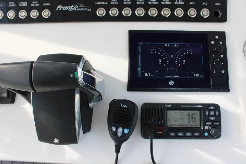 Slide: The Image of 2023 Front Runner 33 Center Console dashboard with controls and navigation display. - 26